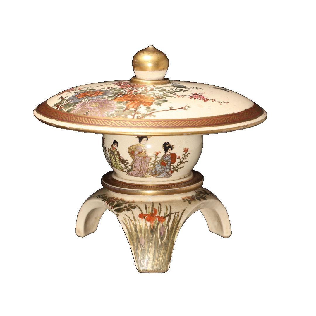 This is a Satsuma ware ornament made for export during the Meiji period.: This is a Satsuma ware ornament made for export during the Meiji period. Its shape resembles a snow-viewing lantern, with a removable shade that contains a compartment for small objects. This artwork
