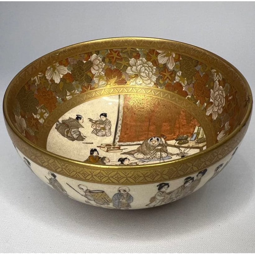 Satsuma ware kinran-style colored enamel gold-decorated tea bowl, depicting scenes of daily life.: Satsuma ware gold and colored enamel tea bowl, depicting scenes of customs. Kinkozan Zobei is a ceramic artist from the Kyoto kiln (Azutaguchi kiln), a style of pottery that has been passed down throu
