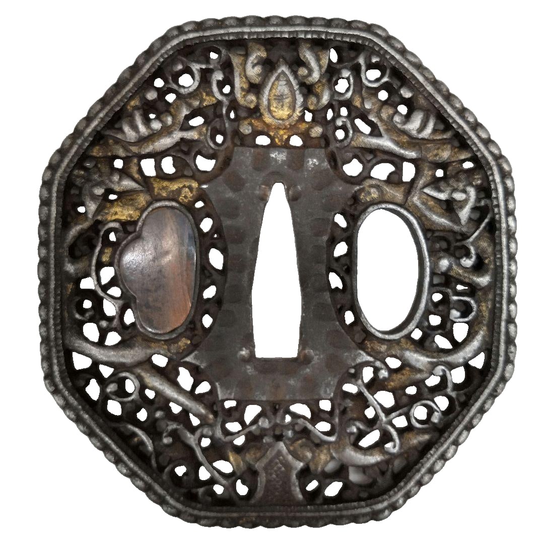 Collection: Arab-style pierced Nanban tachi (sword guard): Introducing a Nanban-style sword guard from a private collection. This exquisite piece features an iron base adorned with intricate Nanban Arab motifs, rendered in both gold and silver hues, with the 