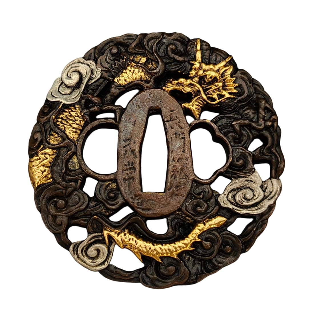 Japanese sword fittings, tsuba, depicting a golden dragon among clouds.: Japanese sword fittings, tsuba, depicting a golden dragon among clouds, copper color, copper base, metalwork, tsuba, used for iaido and kenjutsu. Material: Copper Thickness: Approximately 7 mm