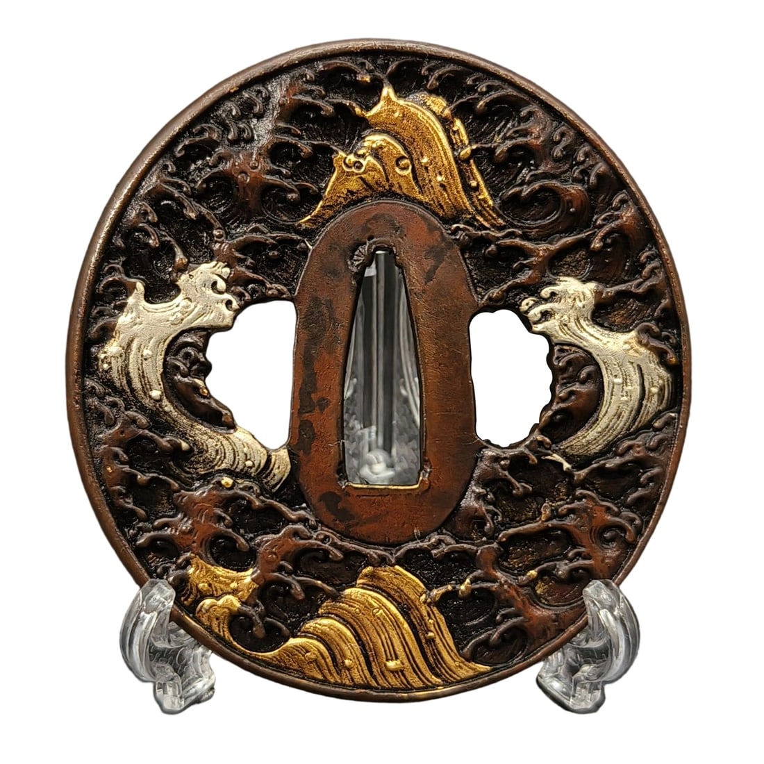 Japanese sword fittings, tsuba, featuring a design of mountains and seas.: Japanese sword fittings, tsuba, featuring a design of mountains and seas, with a copper base, crafted from metal, exhibiting exquisite craftsmanship, used in iaido (the art of drawing the sword), and