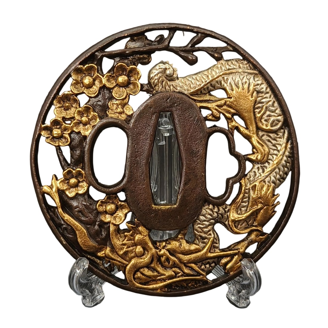Japanese sword fittings, cherry blossom and dragon motif design, tsuba.: Japanese sword fittings, featuring a cherry blossom and dragon motif, tsuba, with a copper base, exquisitely decorated with gold and silver paint, tsuba, martial arts, weaponry. Material: Copper Weigh