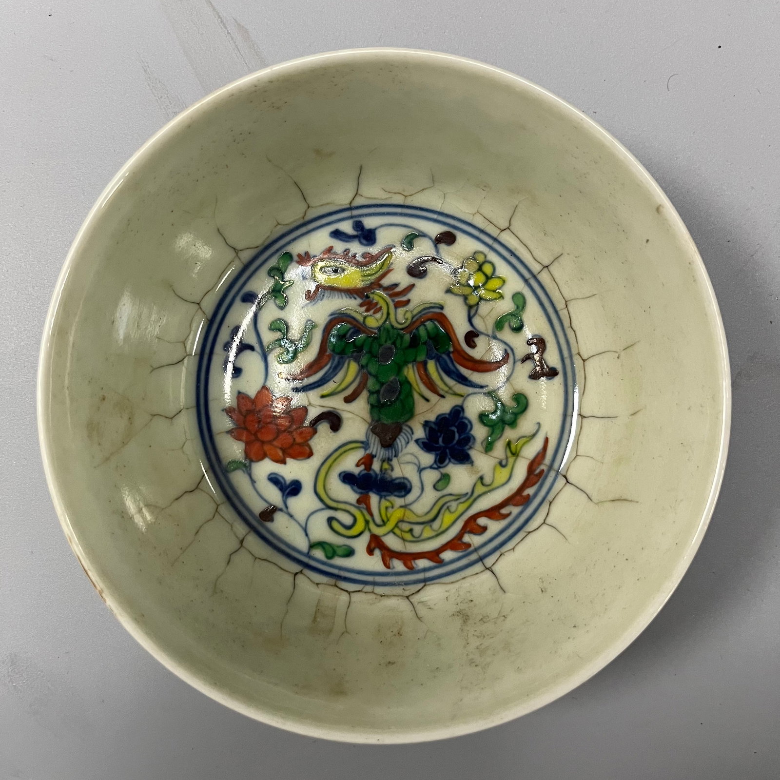 Doucai bowl with pine, bamboo and plum design from the Chenghua period of the Ming Dynasty: This Ming dynasty doucai bowl with pine, bamboo, and plum blossom design measures approximately 13.5cm in diameter and 5cm in height. Its exquisite shape features a flared rim, an arched belly, and a 