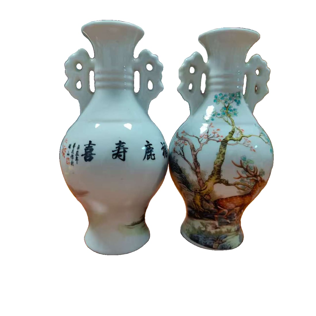 A pair of ceramic vases with landscape decoration: A pair of ceramic vases with landscape decoration, 21 x 12 cm