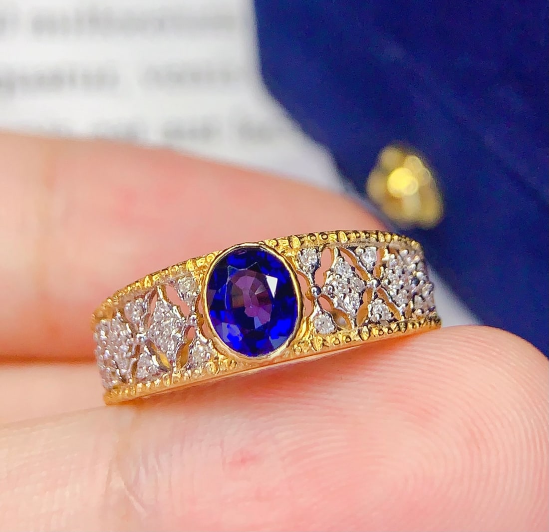 18K Gold Natural Sapphire Ring: This ring is meticulously crafted in 18K gold, featuring a natural sapphire that exudes a captivating brilliance. The surrounding diamonds add a dazzling charm, with an overall design that is elegant