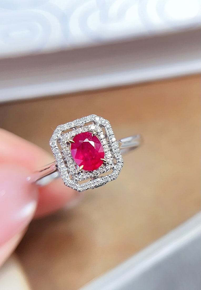 18K Gold Pigeon's Blood Ruby Ring Pendant: This 18K gold ruby ring pendant showcases a classic design. The ruby exhibits an enchanting pigeon's blood red color, clean and flawless. Paired with 58 diamonds, the overall design is exquisite and