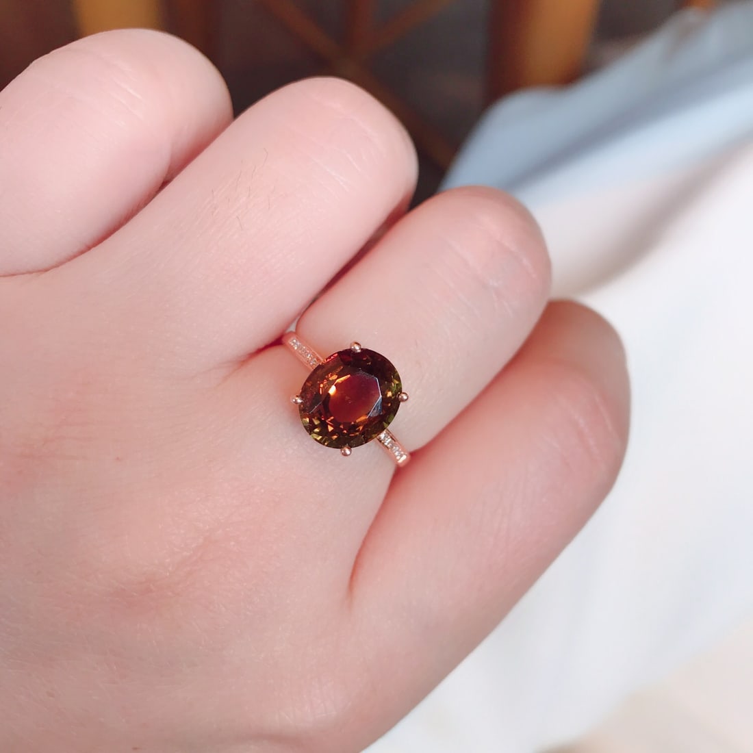 18K Gold Natural Tourmaline Ring: This ring is meticulously set in 18K gold, showcasing the unique charm of natural tourmaline. The tourmaline's rich colors, complemented by 14 sparkling diamonds, exude noble elegance. Whether for