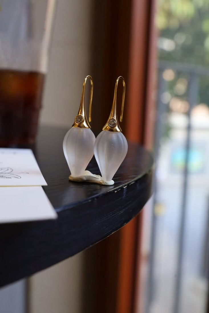 Sterling Silver Natural White Crystal Earrings: These earrings feature natural white crystal as the main stone, showcasing a unique frosted texture. The sterling silver material adds elegance and sophistication.
