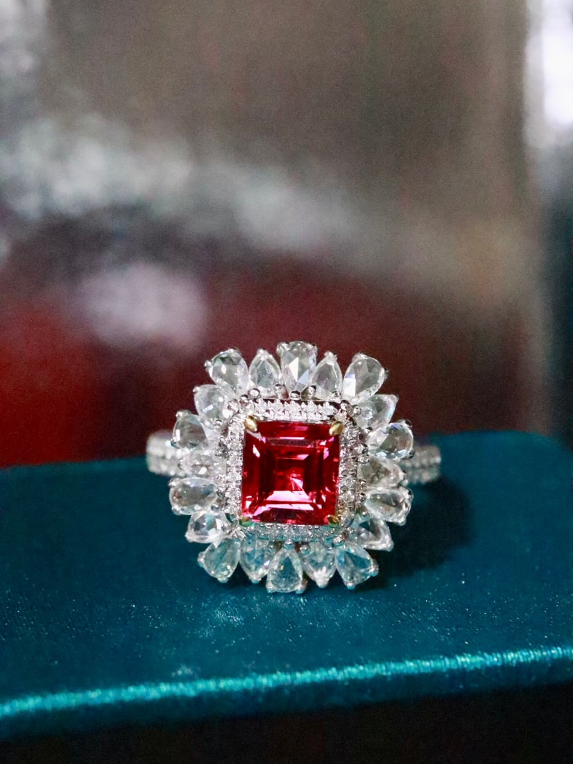 18K Gold Natural Unheated Spinel Ring: This ring showcases the natural allure of spinel with its rich color and elegant charm. The finely set high-quality diamonds add a touch of luxury. (Main stone 1.20 carats, side stones 0.918 carats, g