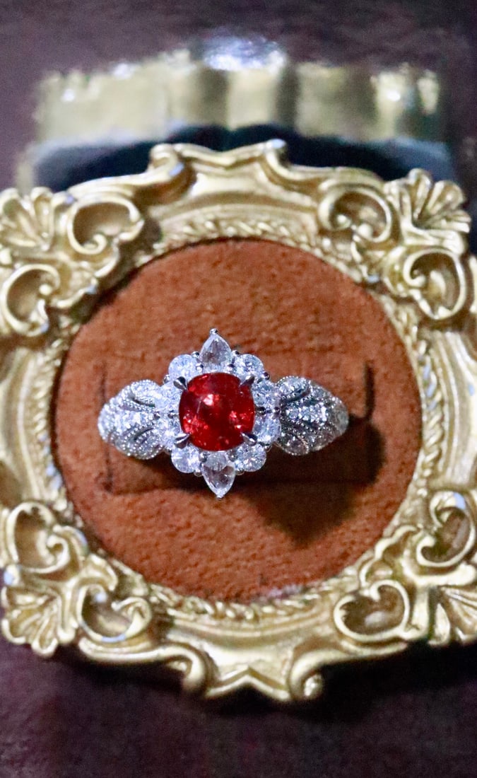 Platinum Natural Unheated Ruby Ring: Platinum outlines delicate patterns, resembling winding vines, gently embracing the vivid unheated ruby. Like a dialogue of souls, it releases a subtle and enchanting charm in the interplay of light a