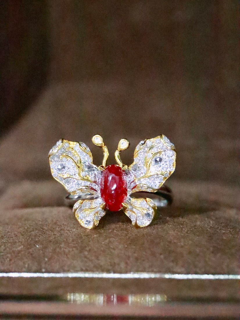 18K Gold Natural No-Heat Ruby Ring: This ring is meticulously crafted in 18K gold, showcasing the natural allure of the no-heat ruby. The vivid color of the main stone complements the brilliance of the diamonds, with exquisite