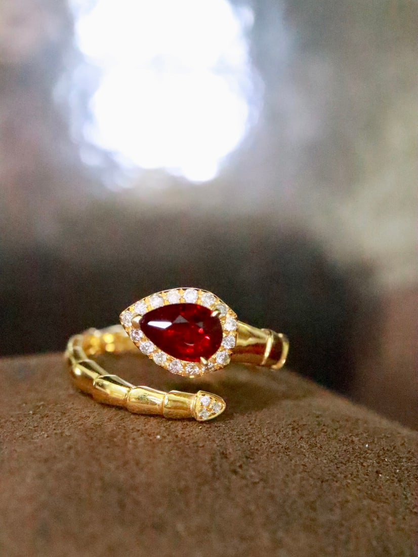 18K Gold Natural No-Heat Ruby Ring: This ring is inspired by the captivating form of a serpent, showcasing unparalleled luxury. The brilliance of the no-heat ruby complements the exquisite design, empowering the wearer with a