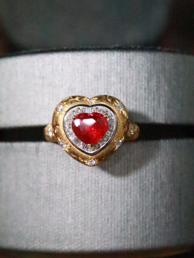 18K Gold Natural Ruby Ring: This ruby ring captivates with its dazzling brilliance and charming heart-shaped design. The exquisite craftsmanship imparts a vintage elegance that is truly stunning. The deep hue of the ruby complem