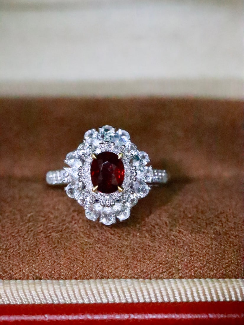 18K Gold Natural Unheated Ruby Ring: This ring is meticulously crafted in 18K gold, featuring a natural unheated ruby that exudes a noble and elegant aura. The rich hue of the ruby, complemented by diamonds and white sapphires, adds a