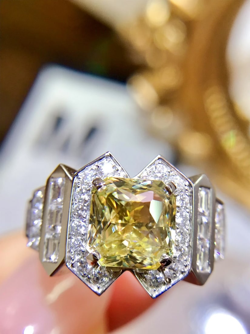 18K Gold Unheated Yellow Sapphire Ring: This ring features a canary yellow sapphire at its center, exuding unparalleled elegance. The unheated nature of the sapphire adds to its rarity, complemented by the brilliant sparkle of diamonds,