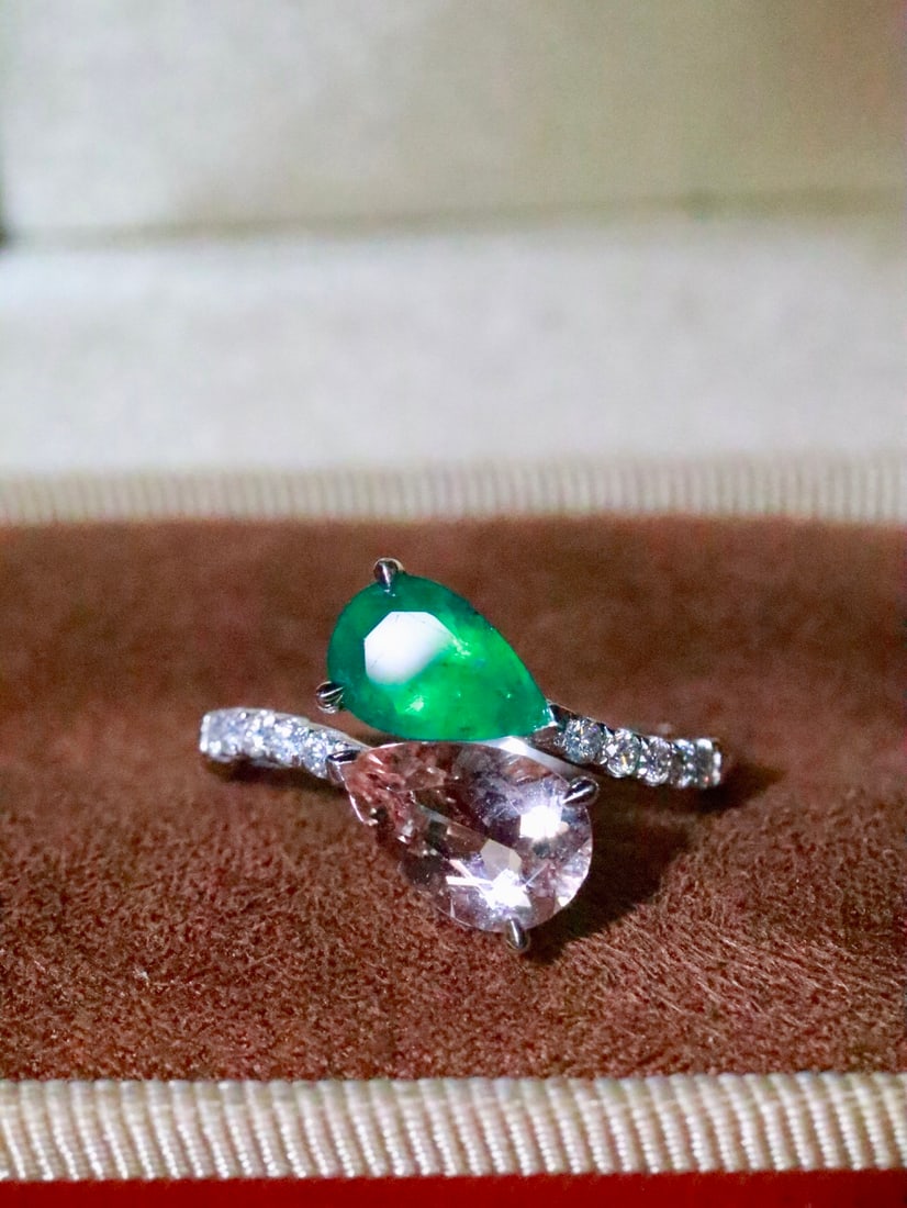 18K Gold Natural Emerald Morganite Ring: This ring is meticulously crafted in 18K gold, showcasing the captivating contrast of emerald and morganite. The open design adds a modern touch, perfect for daily wear. The combination of these two