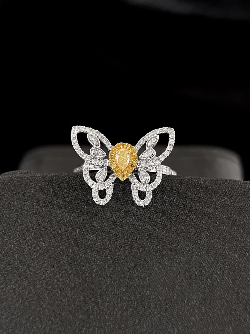 18K Gold Diamond Yellow Diamond Ring: This ring is meticulously crafted in 18K gold, set with brilliant diamonds and yellow diamonds, showcasing an elegant butterfly design. Its exquisite design highlights a noble temperament in every