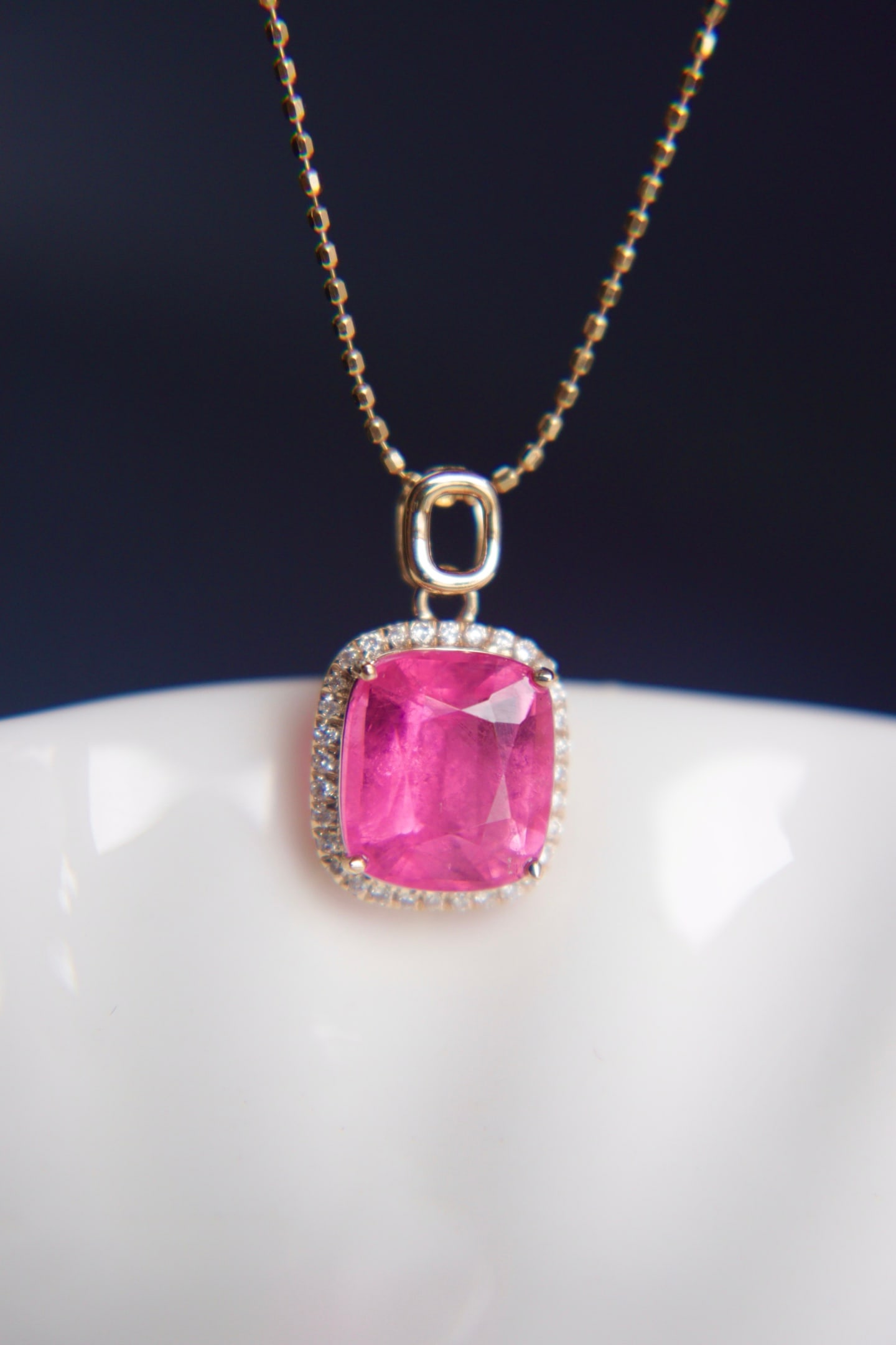 18K Gold Natural Tourmaline Diamond Pendant: This pendant is meticulously crafted in 18K gold, set with a tourmaline of captivating color, showcasing a crystal-clear texture. Complemented by South African diamonds, it adds a touch of luxurious
