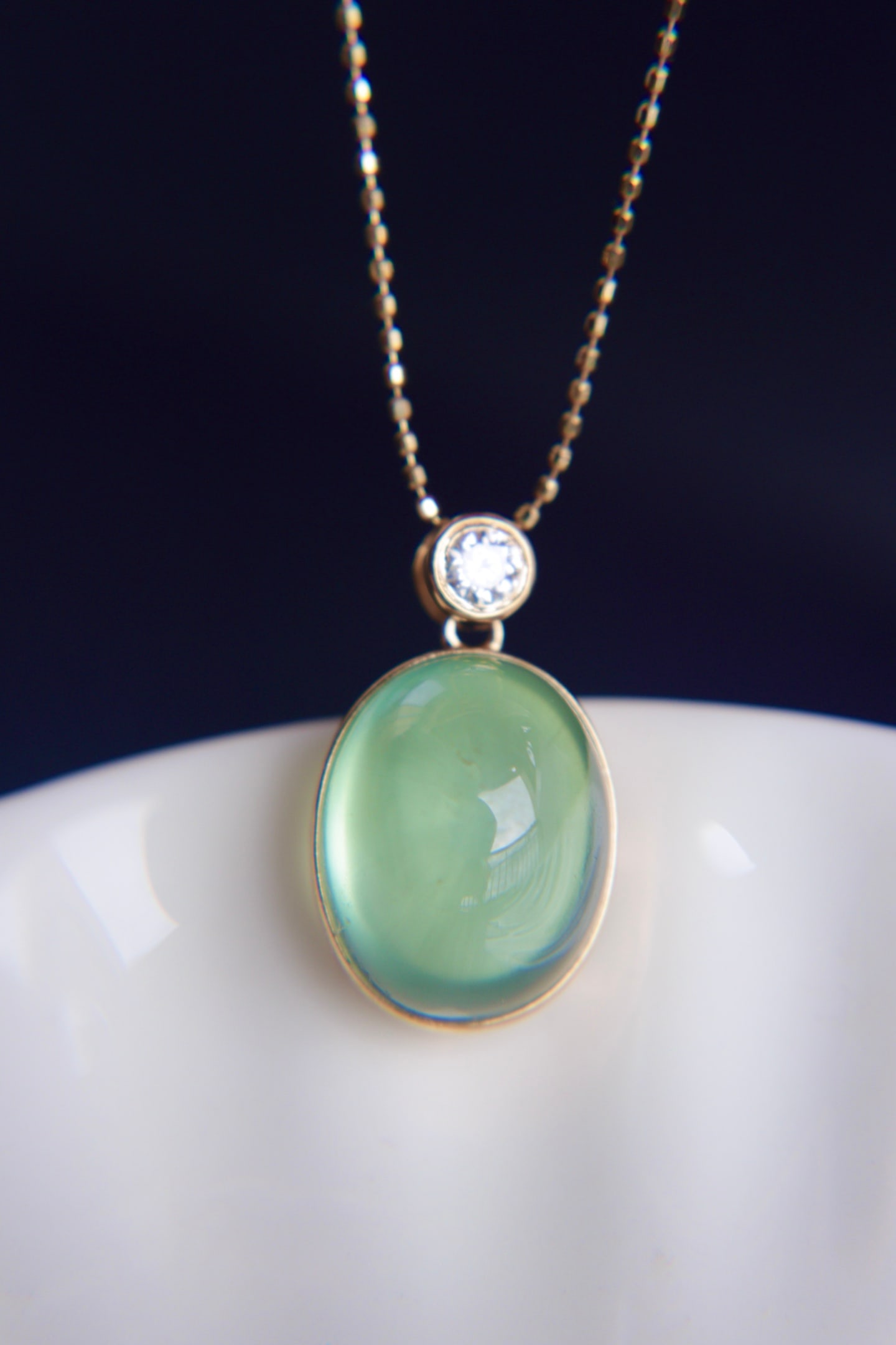 18K Gold Prasiolite Diamond Pendant: This pendant is meticulously crafted in 18K gold, featuring a prasiolite with excellent crystal quality and captivating color. Complemented by South African diamonds, it adds a touch of luxury. (Main 
