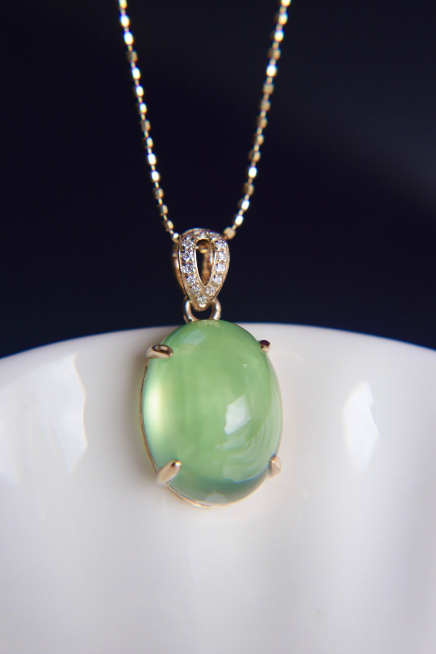 18K Gold Prasiolite Diamond Pendant: This pendant is meticulously crafted in 18K gold, featuring an 11.6-carat prasiolite with captivating color and clarity. Complemented by South African diamonds, it exudes luxury and elegance. (Main st