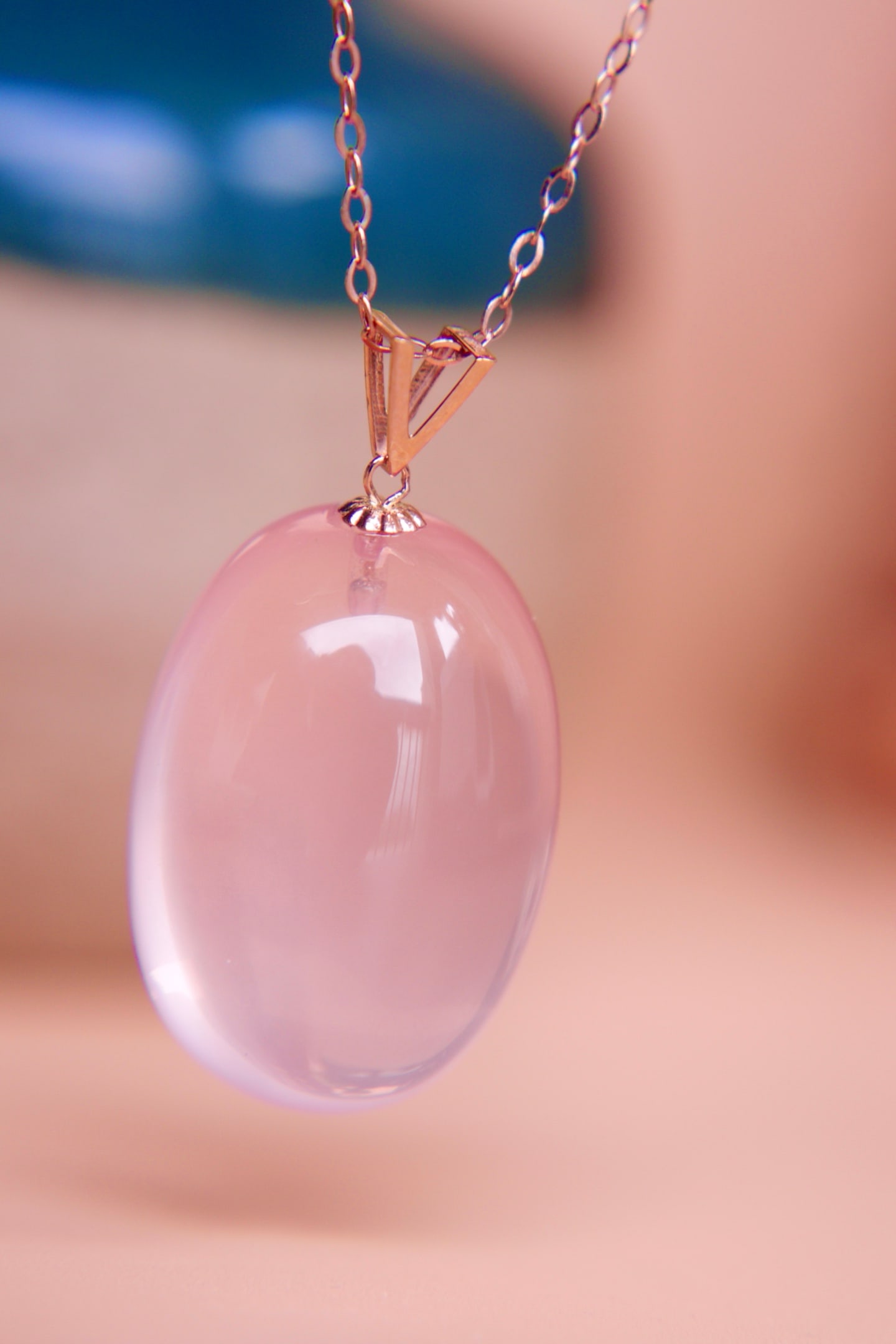 18K Gold Pink Crystal Pendant: This 18K gold pink crystal pendant showcases the pure beauty of the crystal, with a soft and captivating pink hue. The exquisite design combined with high-quality materials makes it suitable for any