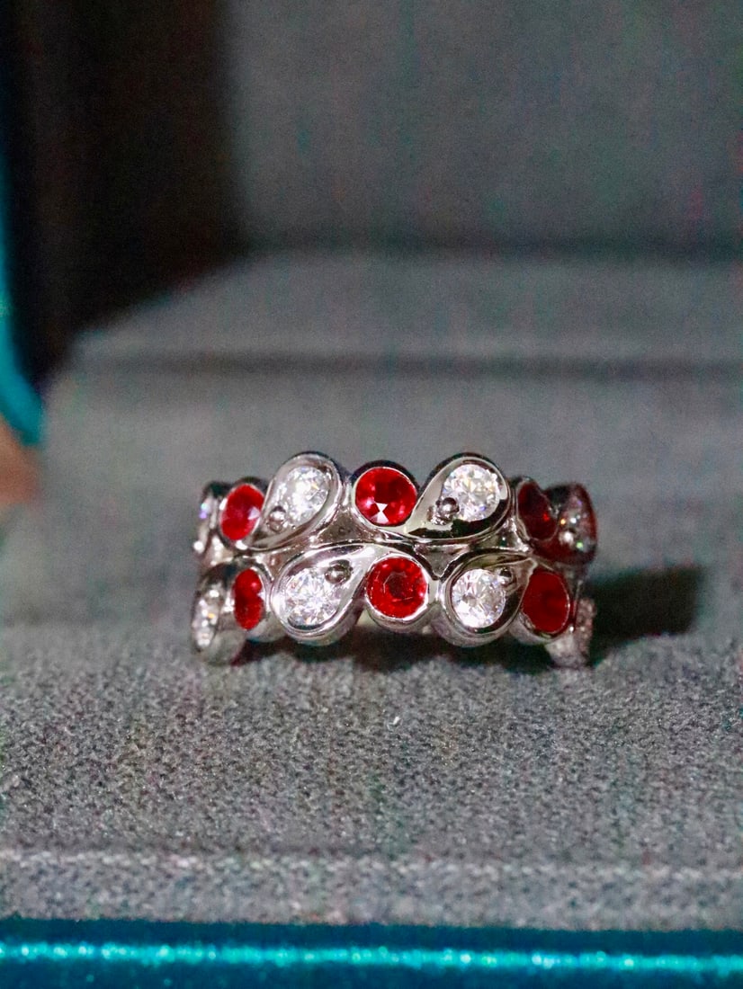 18K Gold Natural Unheated Ruby Ring: This ring resembles a delicate crown, showcasing the vivid color of the ruby. Worn on the finger, it exudes elegance and charm. The unheated ruby adds to its rarity. (Main stone 0.82 carats, gold