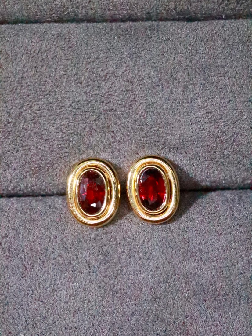 18K Gold Ruby Earrings: These earrings are meticulously crafted in 18K gold, set with brilliant rubies, showcasing classic elegance. The design is simple yet luxurious, suitable for various occasions. (Main stone 0.53