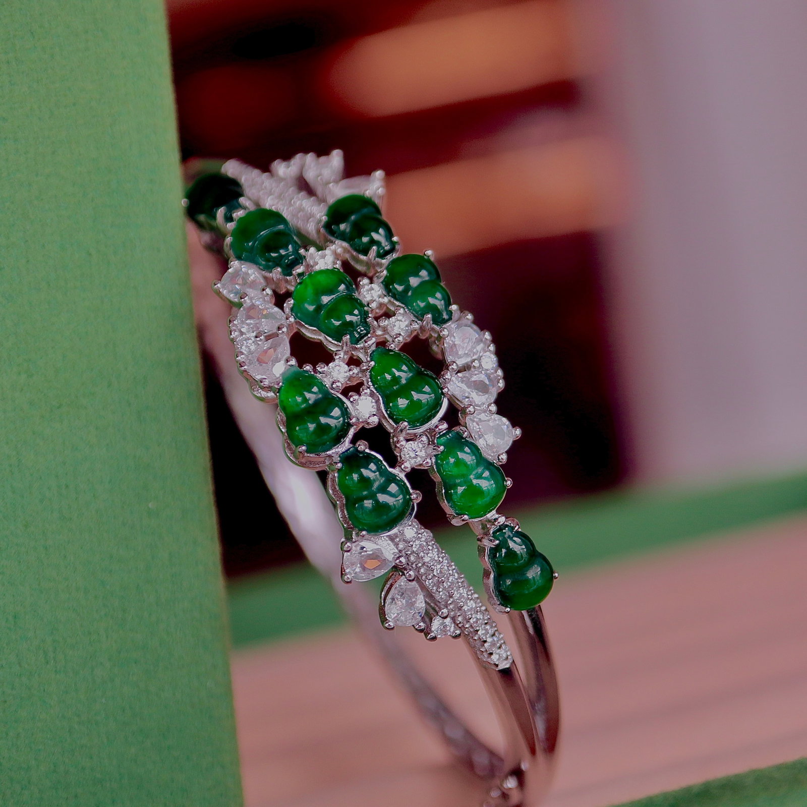 Natural Jadeite Bracelet: This bracelet is crafted from natural jadeite, showcasing a simple yet elegant design. Each jadeite gourd is carefully selected, featuring beautiful color and excellent translucency, symbolizing