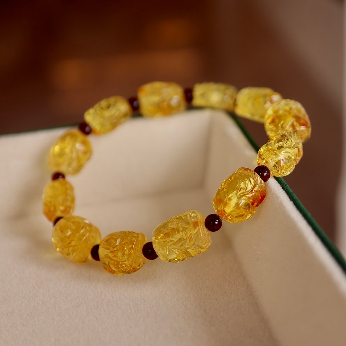 Natural Amber Bracelet: This bracelet is crafted from natural amber, showcasing exquisite craftsmanship and elegant design. Each amber bead is carefully selected, displaying a captivating color and texture. Wearing this