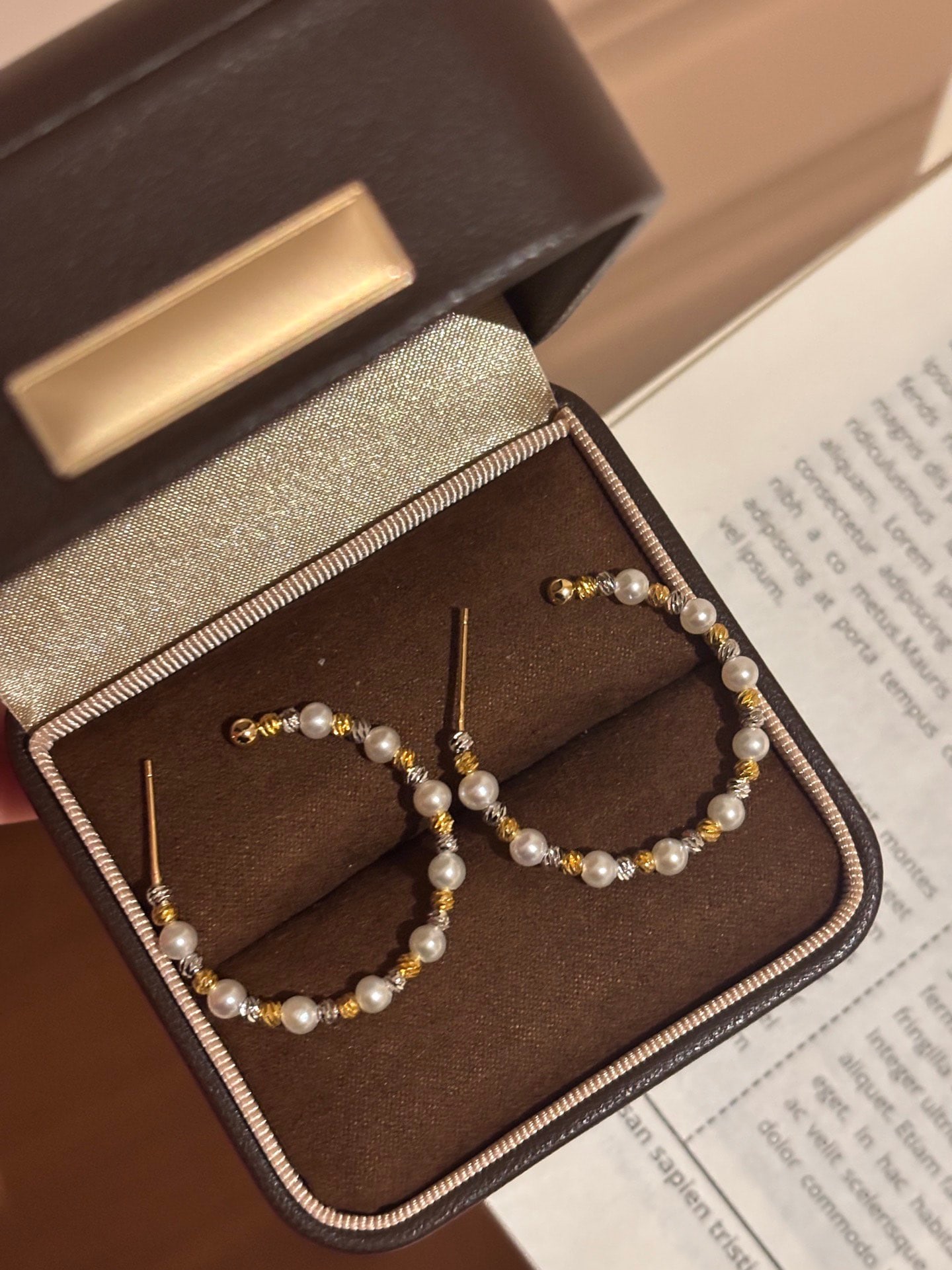 Natural Freshwater Pearl Earrings: These earrings feature natural freshwater pearls, showcasing a strong luster and flawless quality. The gold and silver contrasting design adds a dynamic contour, perfect for everyday wear.