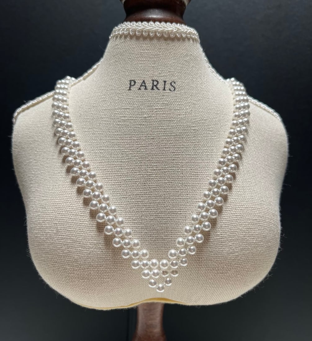 Freshwater Pearl Necklace: This necklace features 3.5-4mm freshwater pearls, showcasing an almost perfect round shape and strong luster. The unique V-shaped woven design elegantly accentuates the neckline. (Pearls 3.5-4mm)