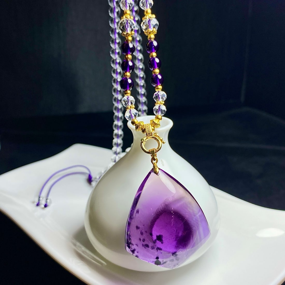 Natural Amethyst Pendant: This natural amethyst pendant is renowned for its transparent crystal and captivating color. The unique sea urchin flower pattern inside the amethyst adds to its distinctive beauty.