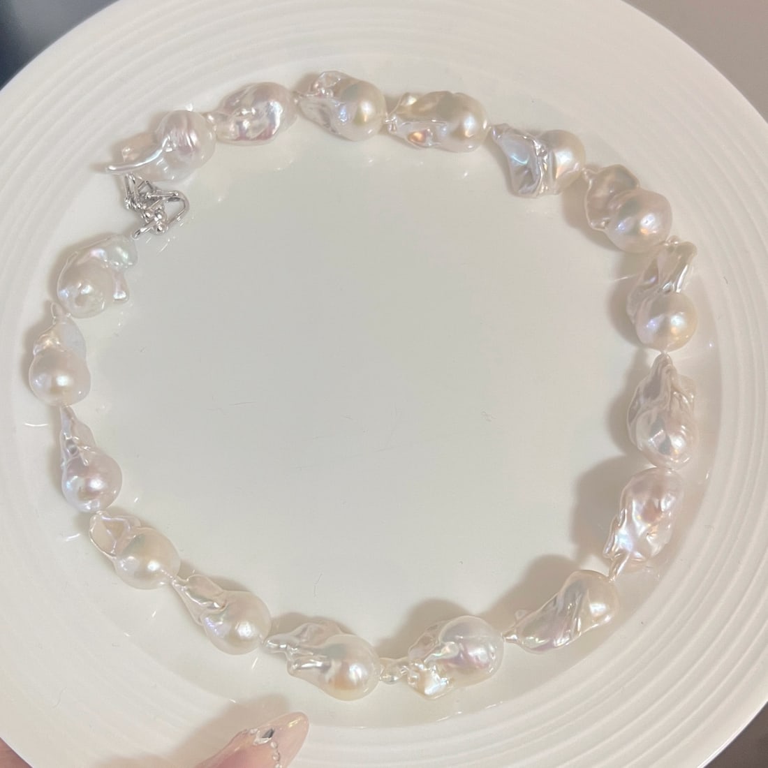 Pure Silver Natural Strong Luster Baroque Freshwater Pearl Necklace: This necklace features a pure silver base, paired with 12-16MM natural strong luster Baroque freshwater pearls, showcasing high-quality natural luster. The S925 silver horse hoof clasp adds a touch