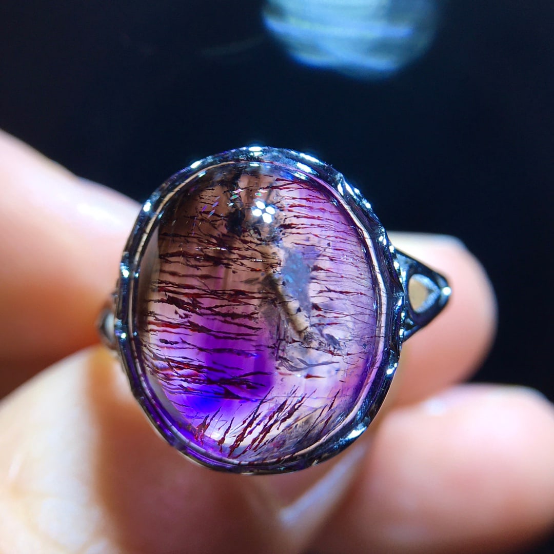 Natural Purple Rutilated Quartz Ring: This ring features a natural purple rutilated quartz as the main stone, showcasing a mysterious and dreamy purple hue. The crystal is lustrous, set in 925 sterling silver with exquisite design. The