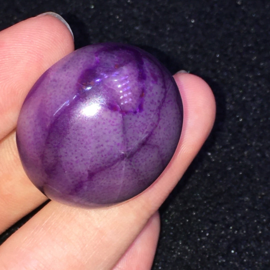 Sugilite Pendant: This Sugilite pendant showcases unique colors and textures, captivating the beholder. Its exquisite design and elegant shape make it a prized collectible. When worn, the natural luster of Sugilite add