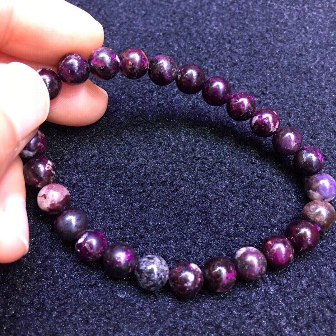 Sugilite Bracelet: This Sugilite bracelet showcases a unique purple luster, with evenly sized beads that are comfortable to wear. Its moderate weight makes it suitable for daily wear and a valuable addition to any