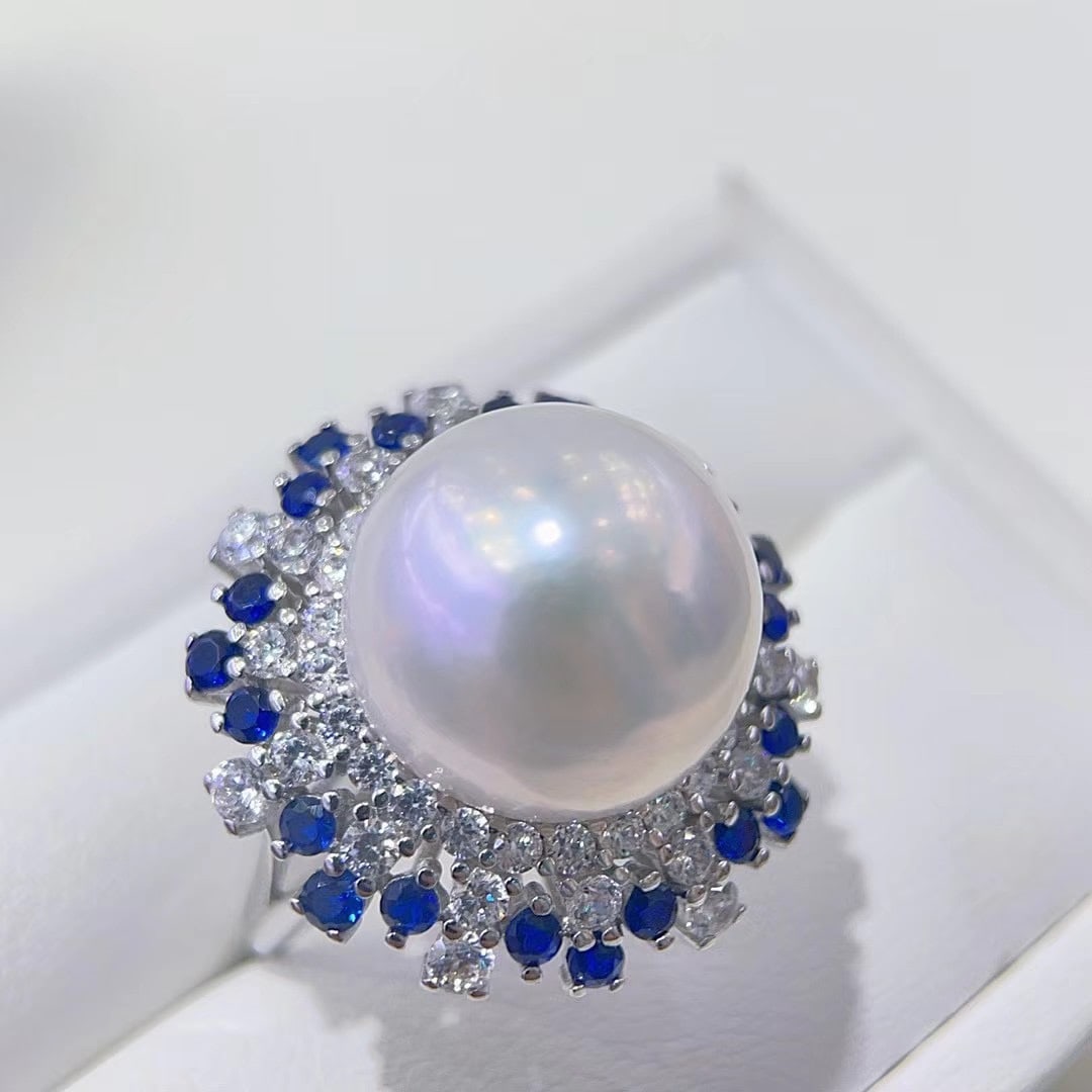925 Silver High-Quality Edison Pearl Ring: This ring features a high-quality Edison pearl, nearly round with slight blemishes and a mirror-like luster. The 925 silver setting is crafted with precision, showcasing elegance and refinement. The