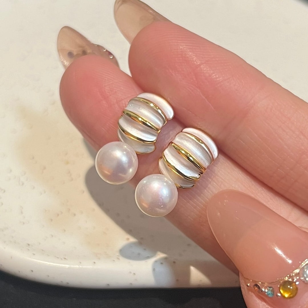 Natural High-Quality Freshwater Pearl Earrings: These earrings feature natural high-quality freshwater pearls, showcasing unique luster and elegance. The advanced enamel technique adds a touch of artistic charm, while the design, reminiscent of a