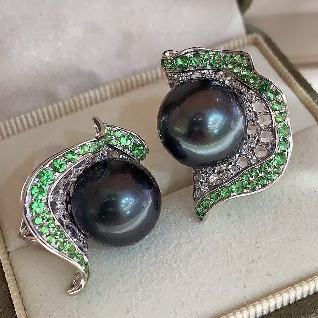 925 Silver Natural Saltwater Tahitian Black Pearl Earrings: These earrings are crafted from 925 silver, featuring natural saltwater Tahitian black pearls. The pearls measure between 10-11mm in diameter, showcasing a near-round perfect shape. The surface is
