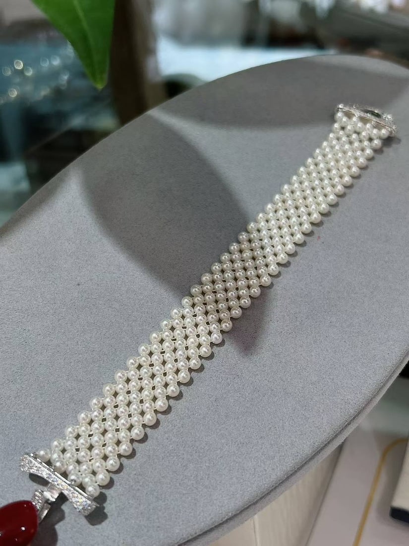 Sterling Silver Freshwater Pearl Bracelet: This bracelet is handcrafted, showcasing the elegance of Chinese palace style. It features baby size freshwater pearls, nearly round with strong white luster and almost flawless. Paired with a