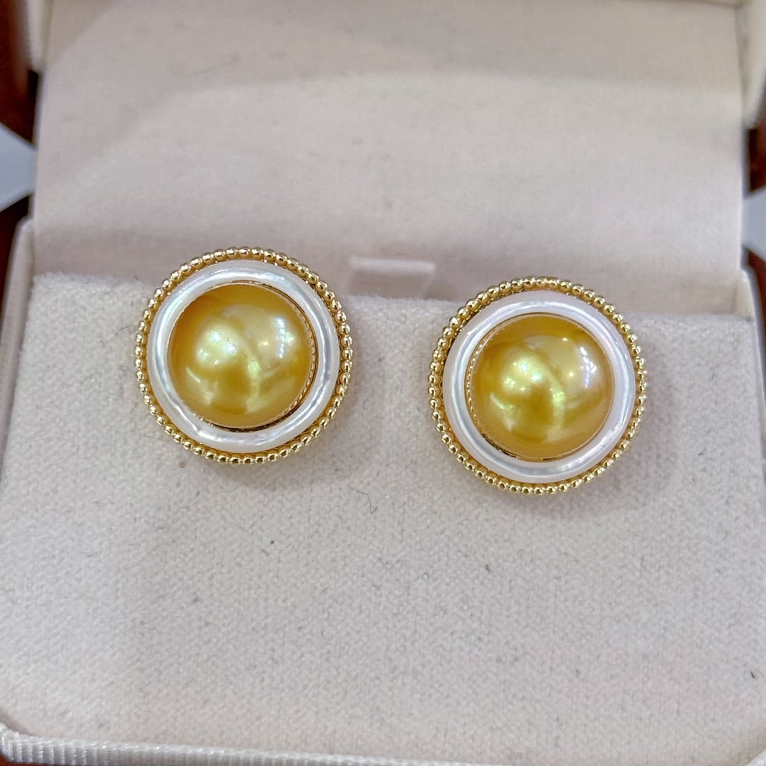 S925 Silver Needle Freshwater Golden Pearl Earrings: These earrings are crafted with exquisite workmanship, showcasing the natural luster and delicate texture of freshwater golden pearls. The pearl surface is smooth with excellent luster, displaying an