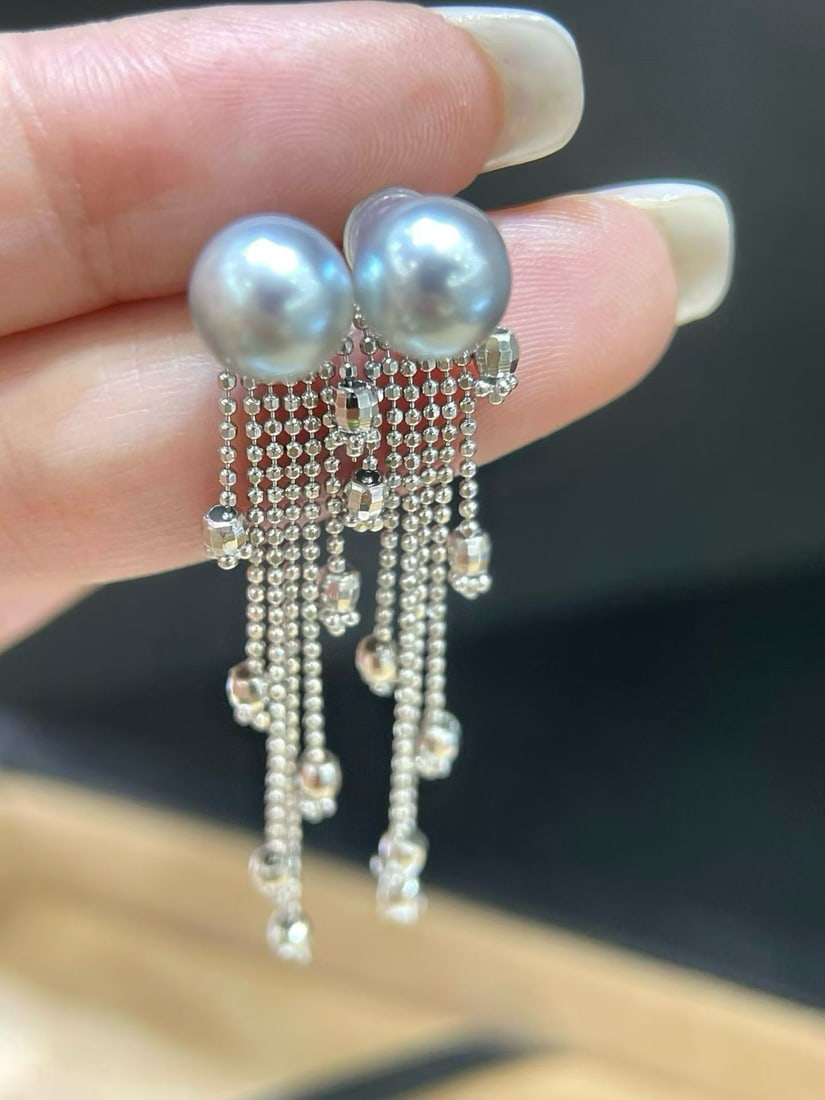 Sterling Silver Akoya Pearl Earrings 7-8mm: These earrings are crafted from sterling silver with a cascading tassel design that adds movement. The 7-8mm pearls are lustrous and smooth, showcasing an almost flawless perfect round shape. The