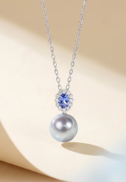 18K Gold Tanzanite Akoya Pearl Pendant: This pendant features an 18K gold base, paired with a cushion-shaped tanzanite and Akoya pearl, showcasing a perfect blend of elegance and luxury. The luster of the pearl and the color of the