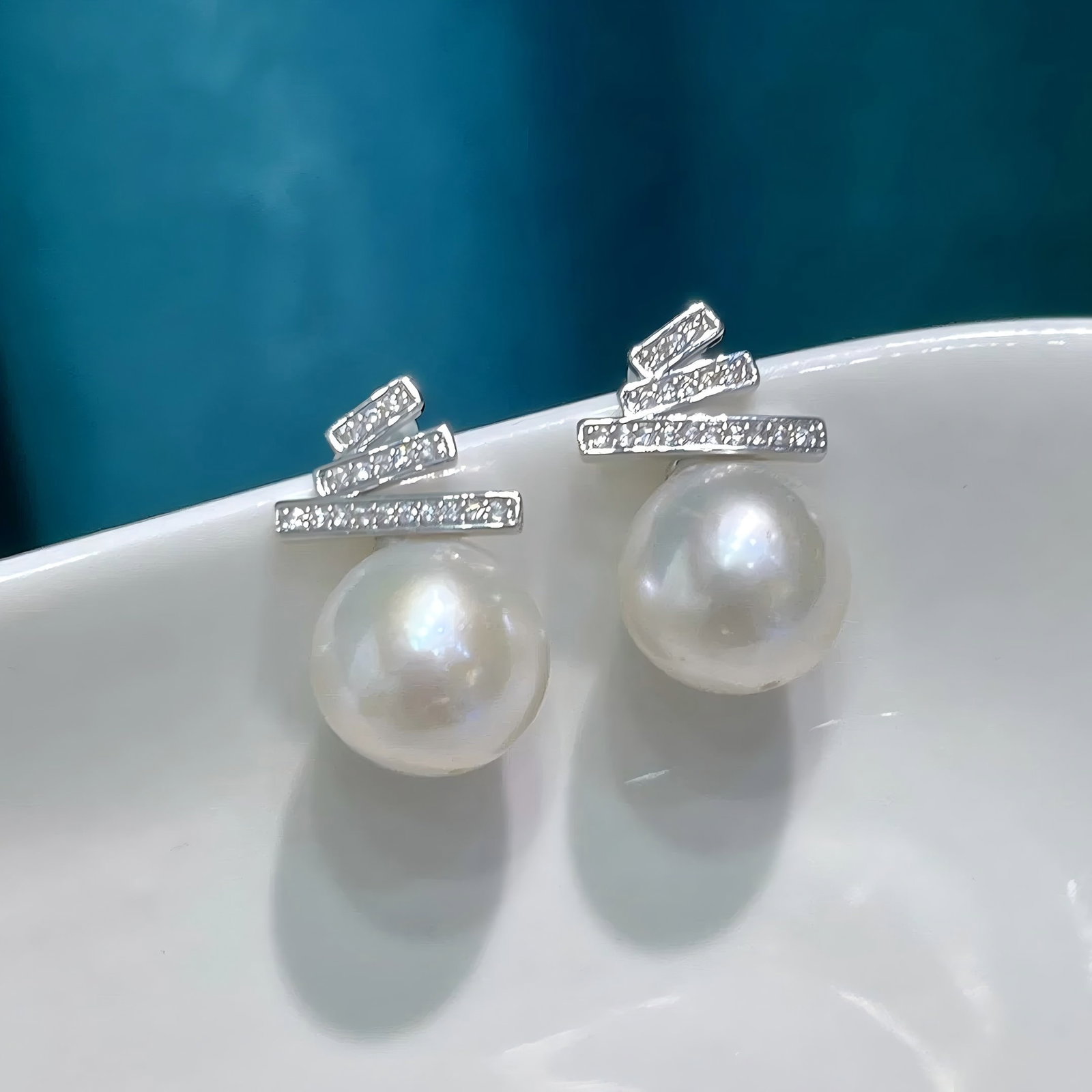 Natural pearl earrings: Natural pearl earrings, approximately 11-12 mm in diameter.