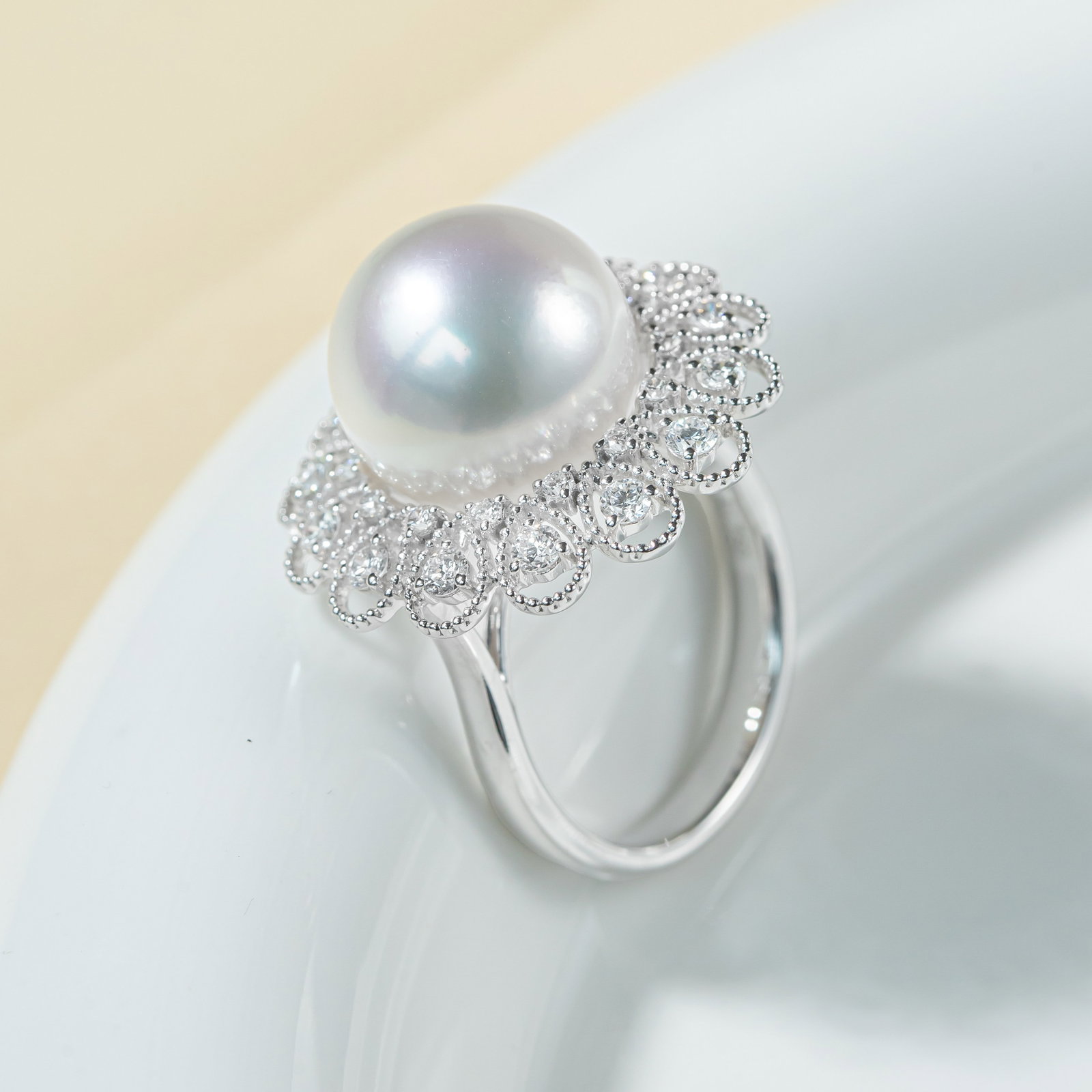 18K Gold South Sea White Pearl Ring: This ring is meticulously crafted in 18K gold, set with a South Sea white pearl, showcasing the pearl's natural luster and elegance. The near-round shape of the pearl adds unique charm, suitable for v