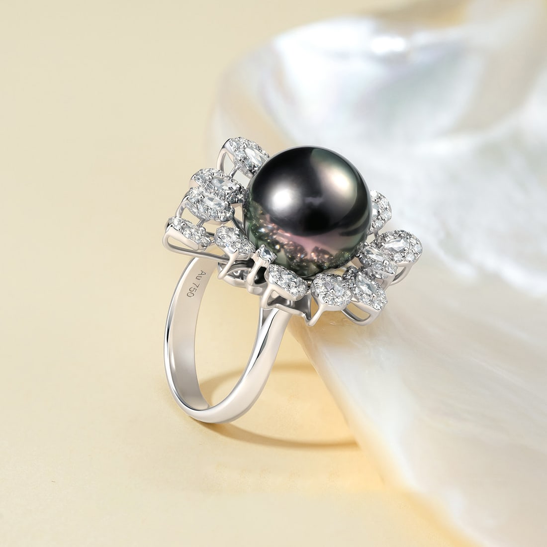 18K Gold Tahitian Pearl Ring: This ring is meticulously crafted in 18K gold, set with a Tahitian pearl that showcases its natural luster and elegance. The round shape of the pearl complements the sheen of the metal, making it suit
