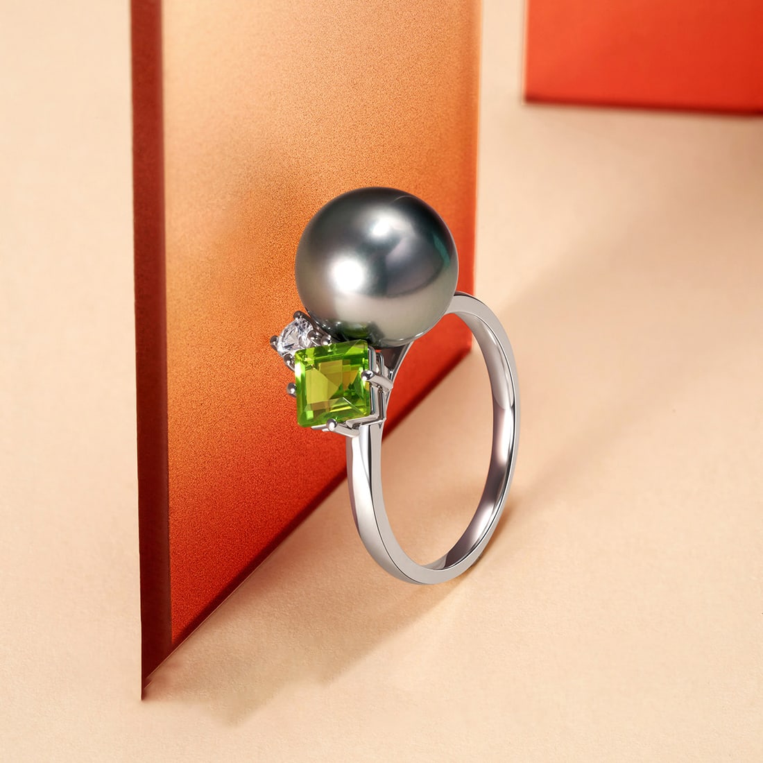 18K Gold Tahitian Black Pearl Ring: This ring is meticulously crafted in 18K gold, set with a Tahitian black pearl that showcases its natural luster and elegance. The deep hue of the pearl complements the brilliance of the metal, making