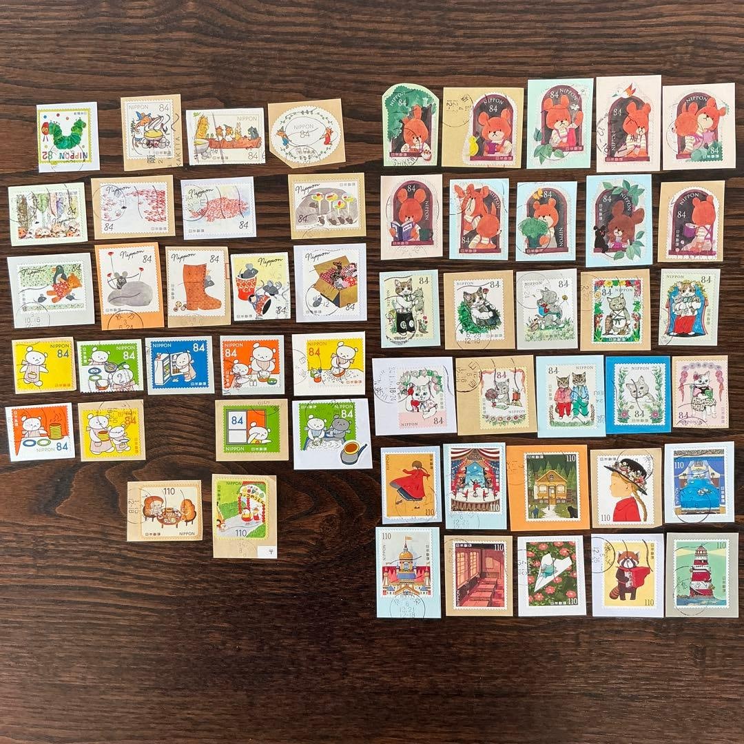 Used stamps, a total of 54 pieces, from the Picture Book World series.: This set of stamps includes 54 vintage stamps from the "World of Picture Books" series, accompanied by paper inserts. Volume 2: The Very Hungry Caterpillar (1 sheet) Volume 3: Kiri and Gura (3