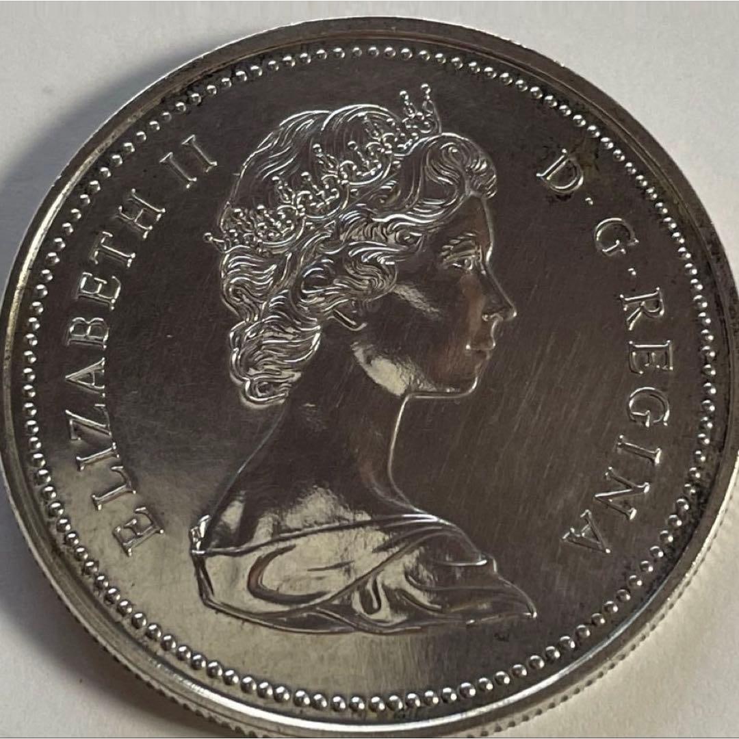 1973 Canadian Royal Canadian Mounted Police Proof Silver Coin (Guaranteed Authentic), with Original: Canadian One Dollar Coin, featuring the portrait of Queen Elizabeth II on the obverse, weighing 23.48 grams, commemorative design. Proof Silver Coin Obverse Design: Portrait of Queen Elizabeth II Reve