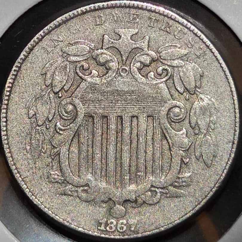 (Rare) United States Shield Nickel (No Rays), Copper-Nickel Alloy Coin, 1867: This is the second nickel (5 cents) copper-nickel alloy coin issued by the United States. This type of coin lacks the characteristic luster (halo). It was issued between 1866 and 1883. Early